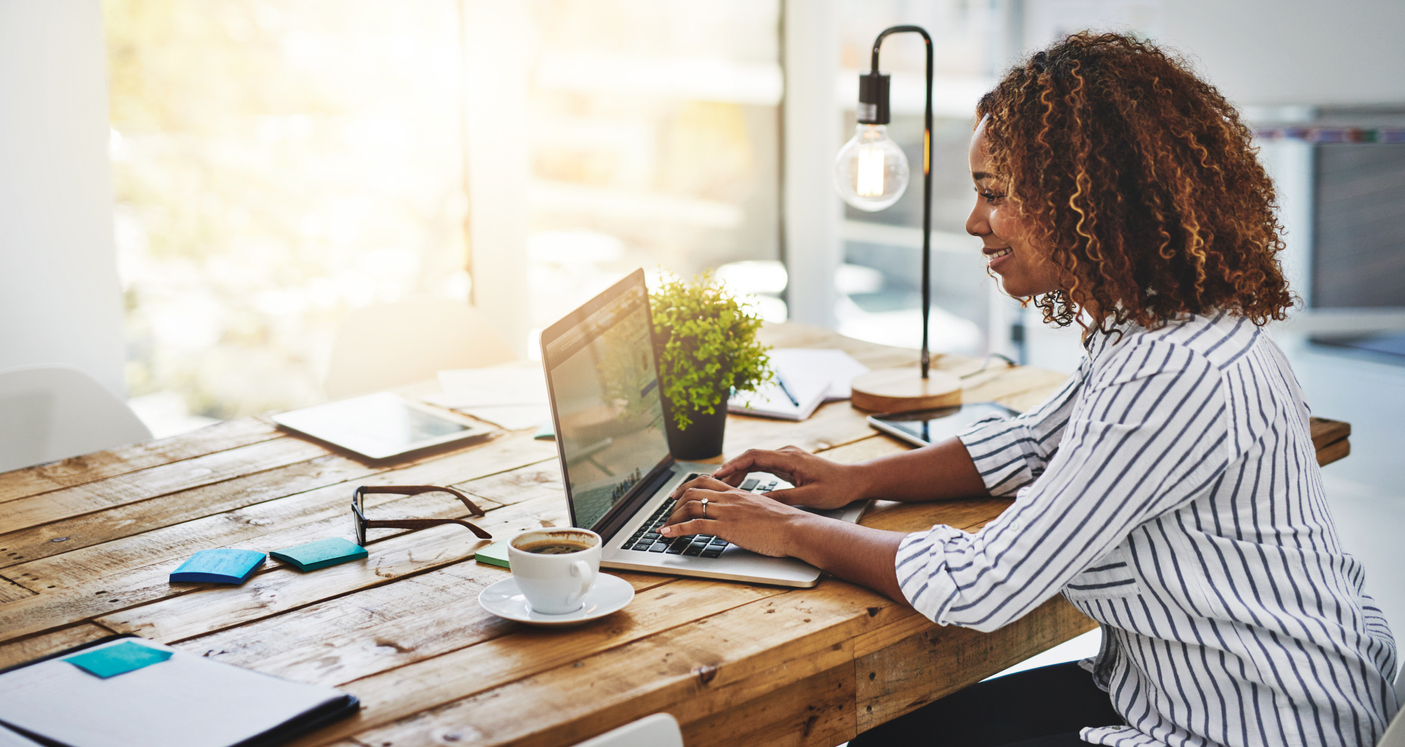 woman using laptop for content creation